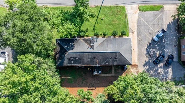 an aerial view of a house with a garden