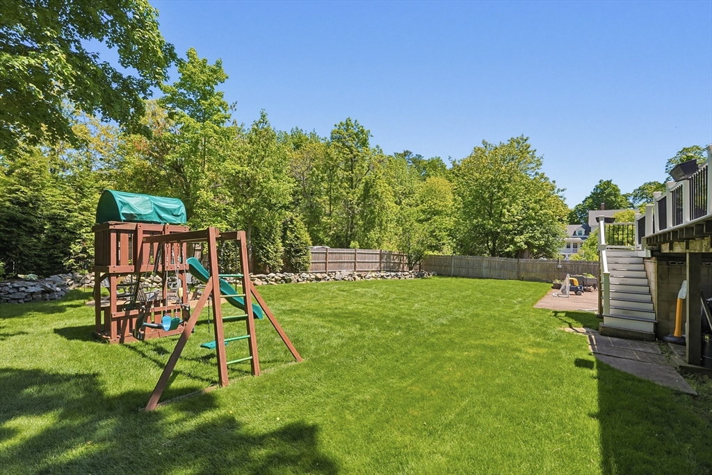 345 Sherman Street Canton, MA 02021 - Photo 37 of 42 a view of a garden with a slide