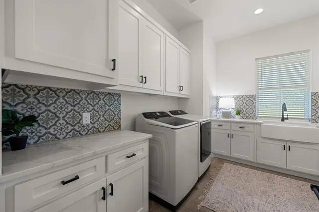 a kitchen with a sink and cabinets