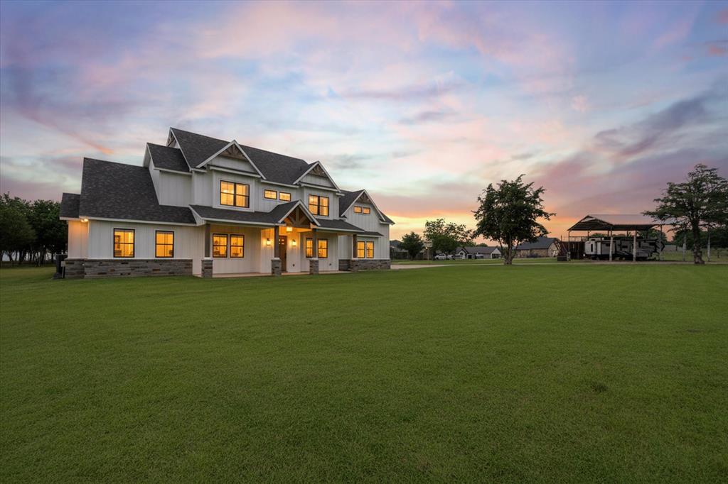 11077 Highway 287, Unit 1 Kerens, TX 75144 - Photo 2 of 40 a front view of a house with a yard and trees
