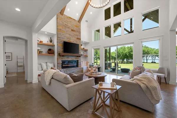 a living room with furniture fireplace and a flat screen tv