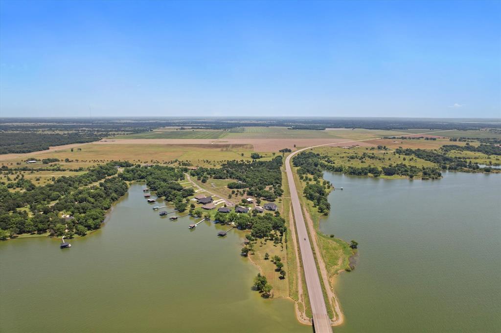 11077 Highway 287, Unit 1 Kerens, TX 75144 - Photo 37 of 40 a view of a lake with a city
