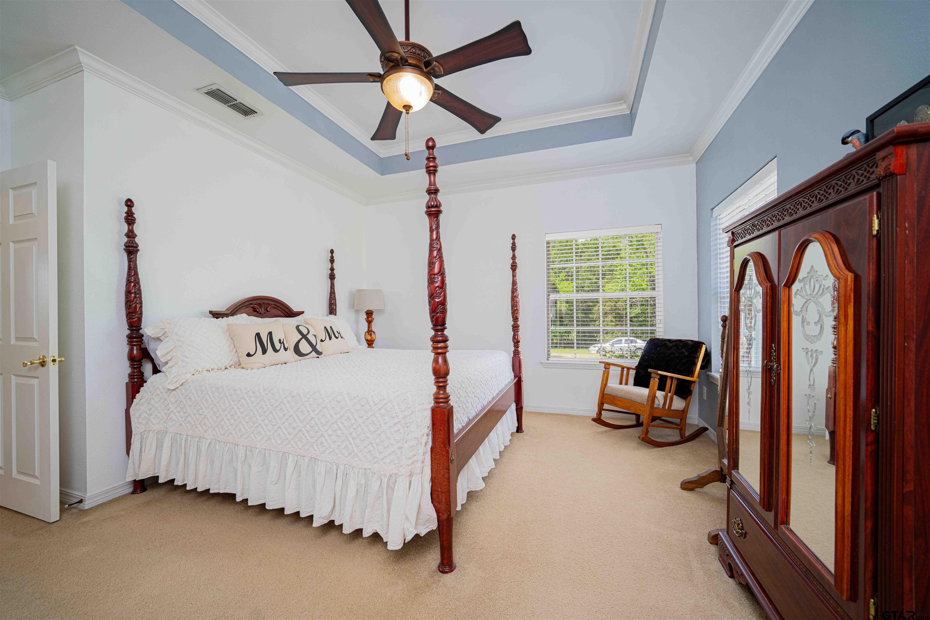 1855 Phillips Springs Road Gladewater, TX 75647 - Photo 14 of 36 a bedroom with a bed and a large window