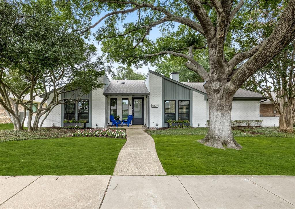 15627 Golden Creek Road Dallas, TX 75248 - Photo 1 of 1 a front view of a house with garden