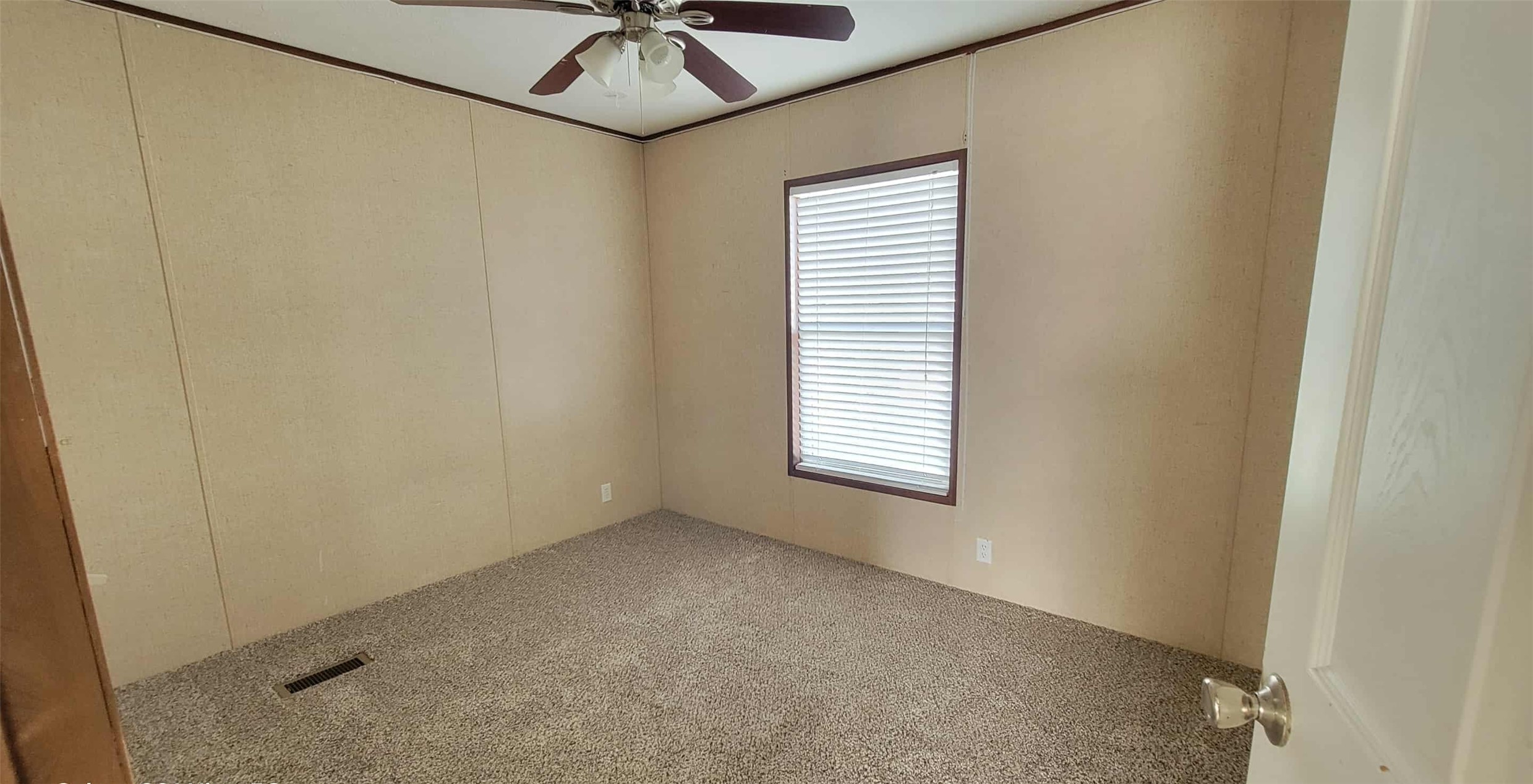 405 Battlebell Road, Unit 2 Highlands, TX 77562 - Photo 15 of 21 a view of a livingroom with a window and a ceiling fan