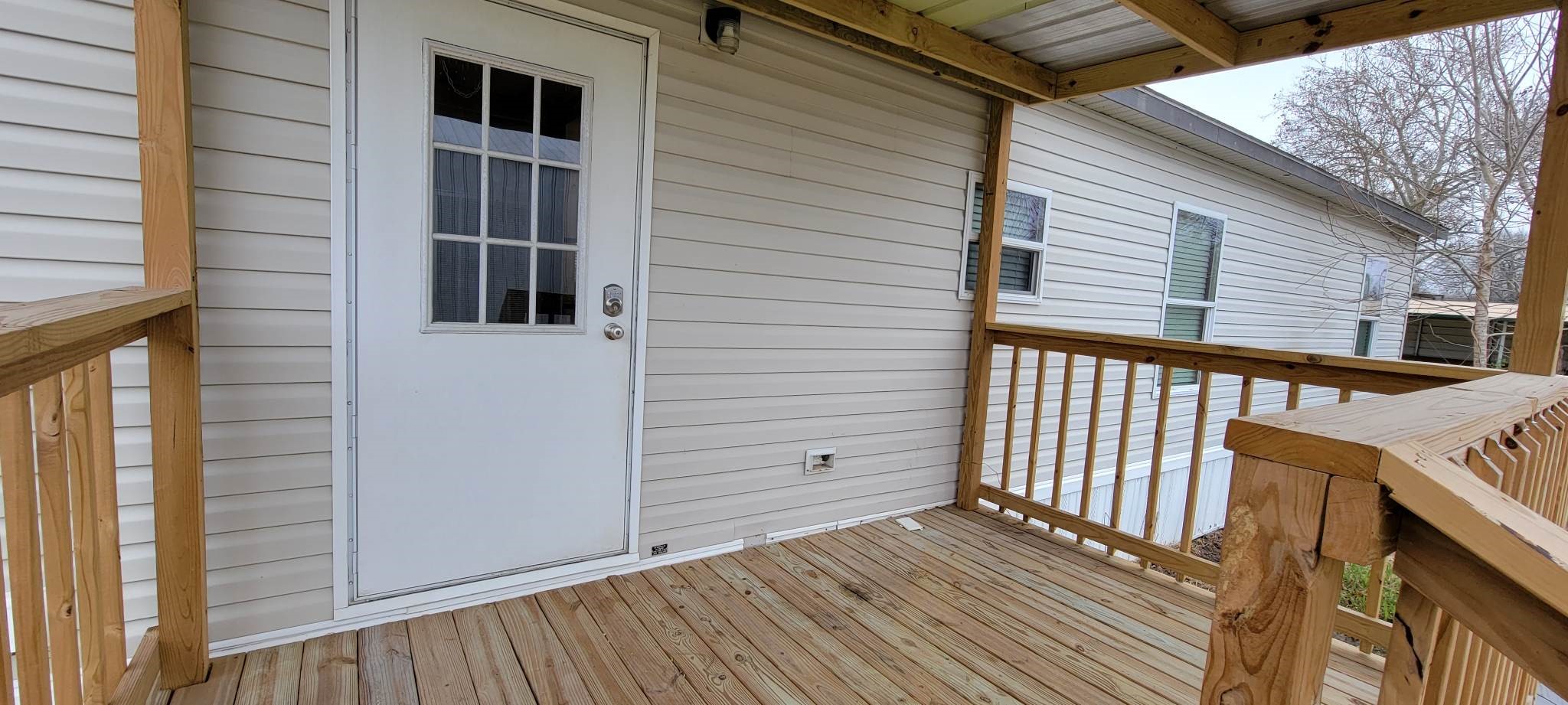 405 Battlebell Road, Unit 2 Highlands, TX 77562 - Photo 20 of 21 a view of a house with wooden floor