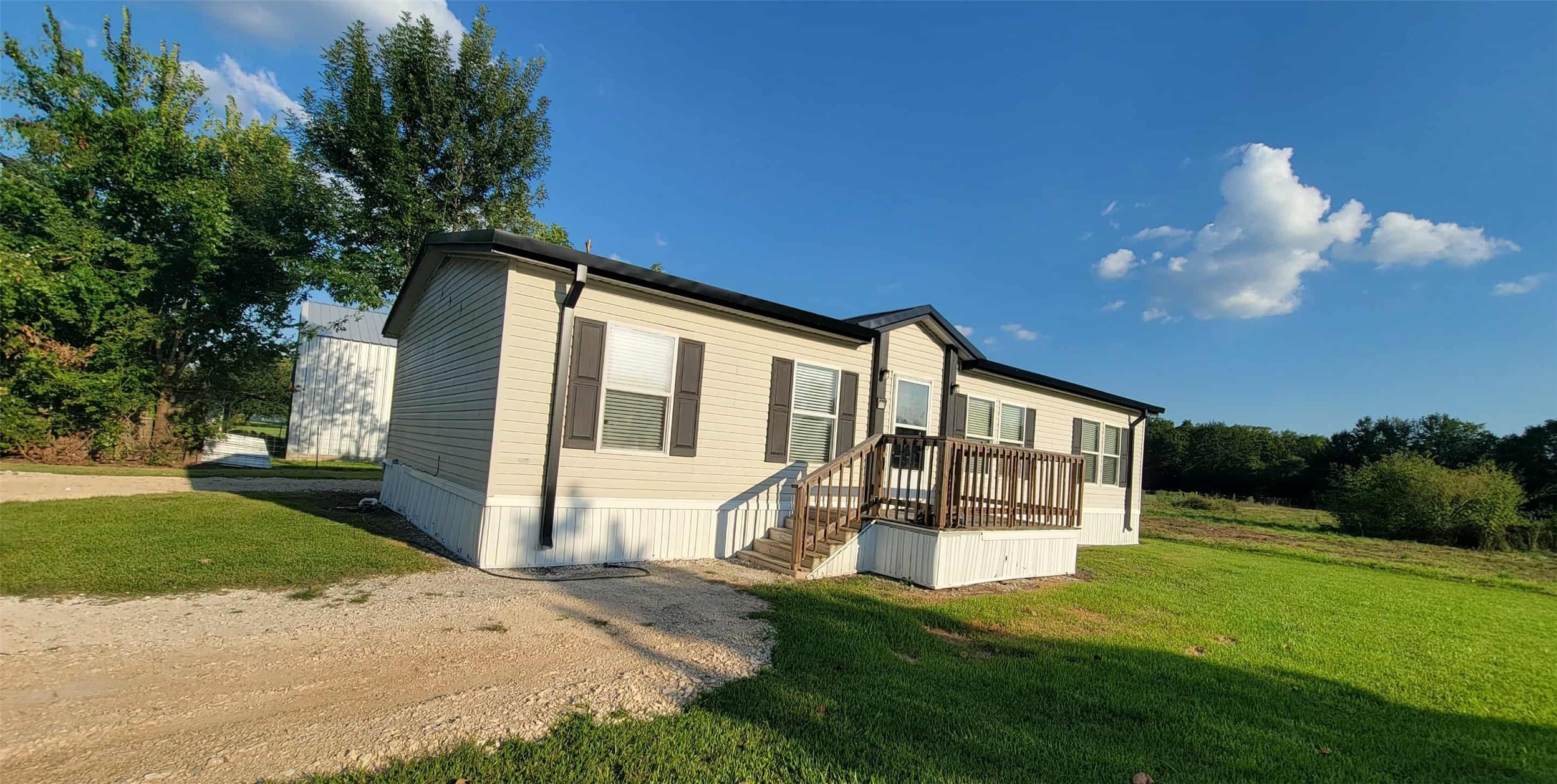 405 Battlebell Road, Unit 2 Highlands, TX 77562 - Photo 2 of 21 a front view of a house with a yard