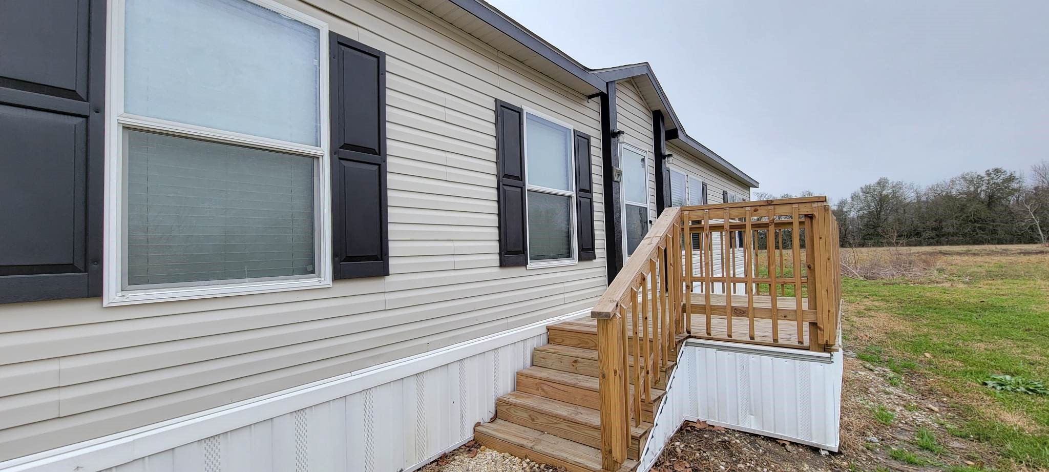405 Battlebell Road, Unit 2 Highlands, TX 77562 - Photo 3 of 21 a view of balcony with wooden floor and fence