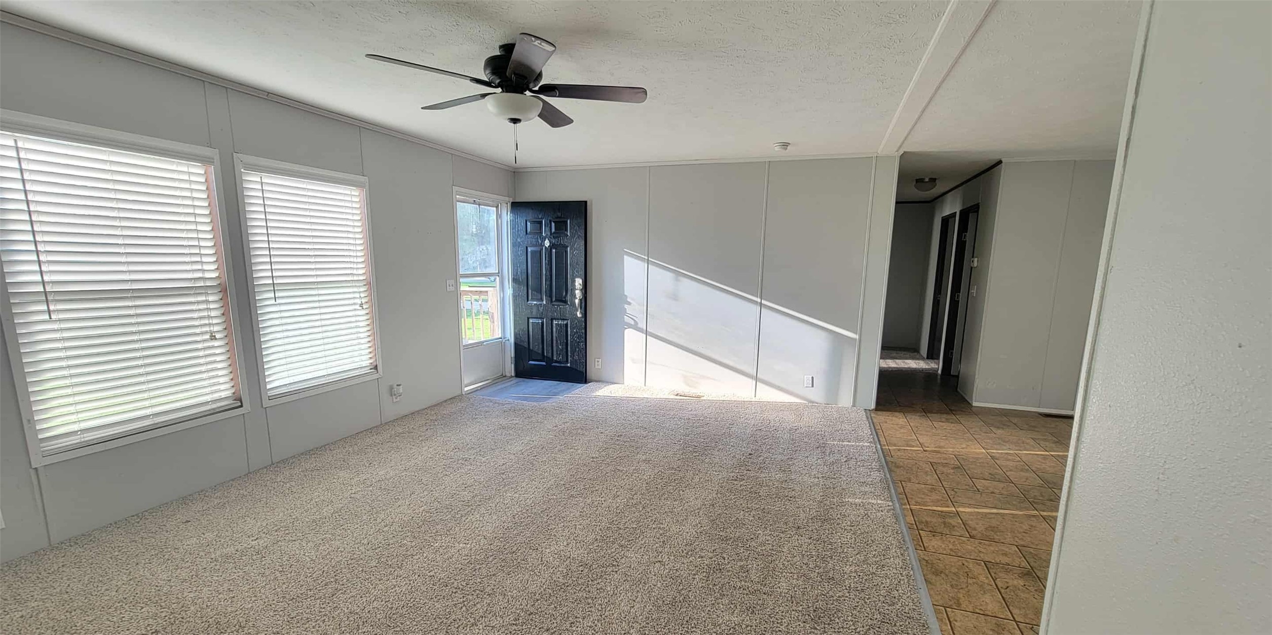 405 Battlebell Road, Unit 2 Highlands, TX 77562 - Photo 8 of 21 a view of livingroom with a ceiling fan and window