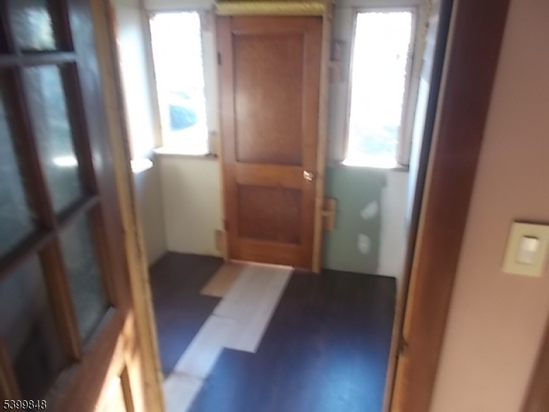 104 Riggs Place West Orange, NJ 07052 - Photo 11 of 23 an empty room with wooden floor and windows