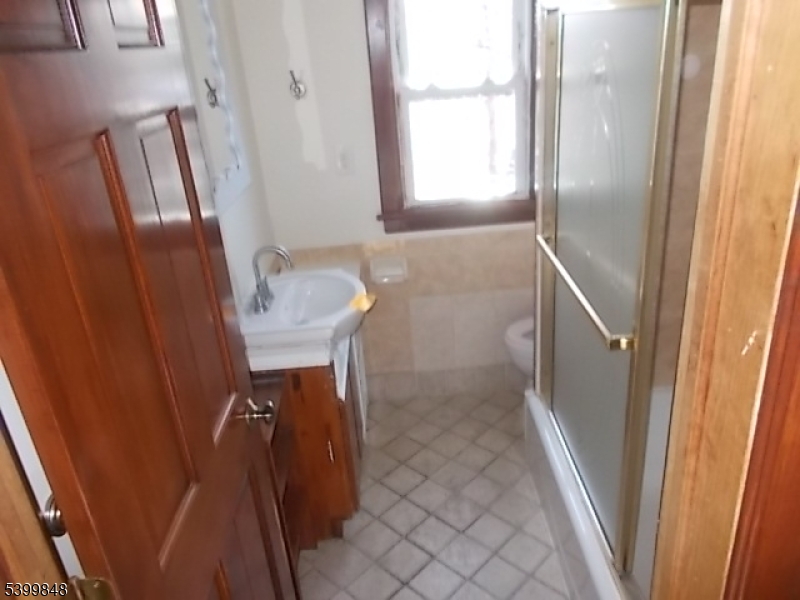 104 Riggs Place West Orange, NJ 07052 - Photo 9 of 23 a bathroom with a sink and a mirror