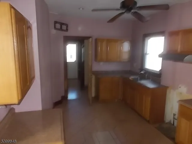 a view of a hallway with windows