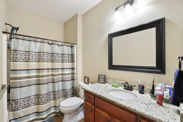 an aerial view of a house with garden space and street view