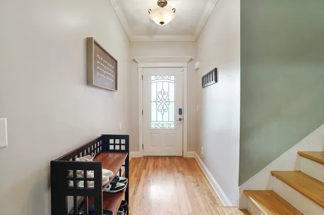 a living room with furniture and kitchen view