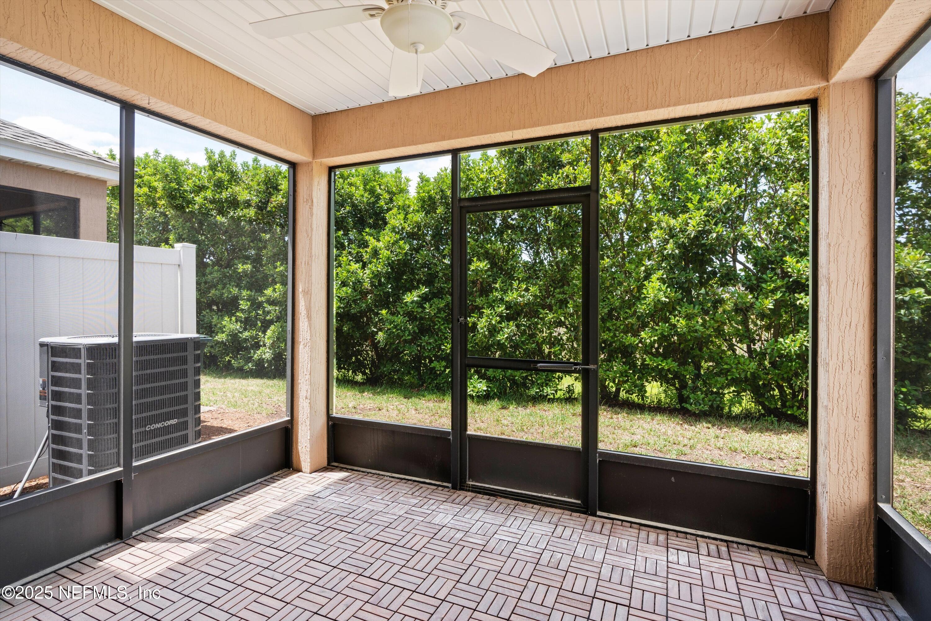 13340 Ocean Mist Drive Jacksonville, FL 32258 - Photo 22 of 25 a view of empty room with wooden floor and iron stairs