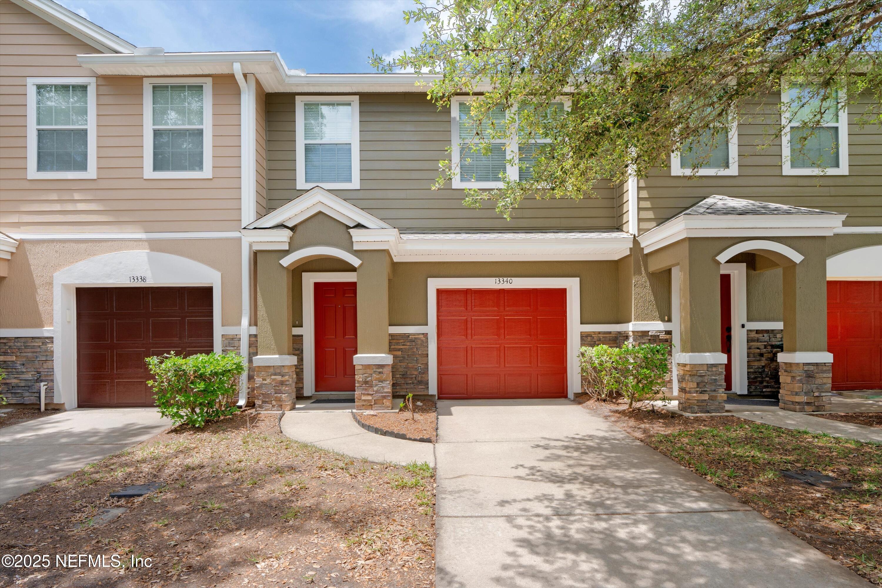 13340 Ocean Mist Drive Jacksonville, FL 32258 - Photo 4 of 25 a front view of a house with garden