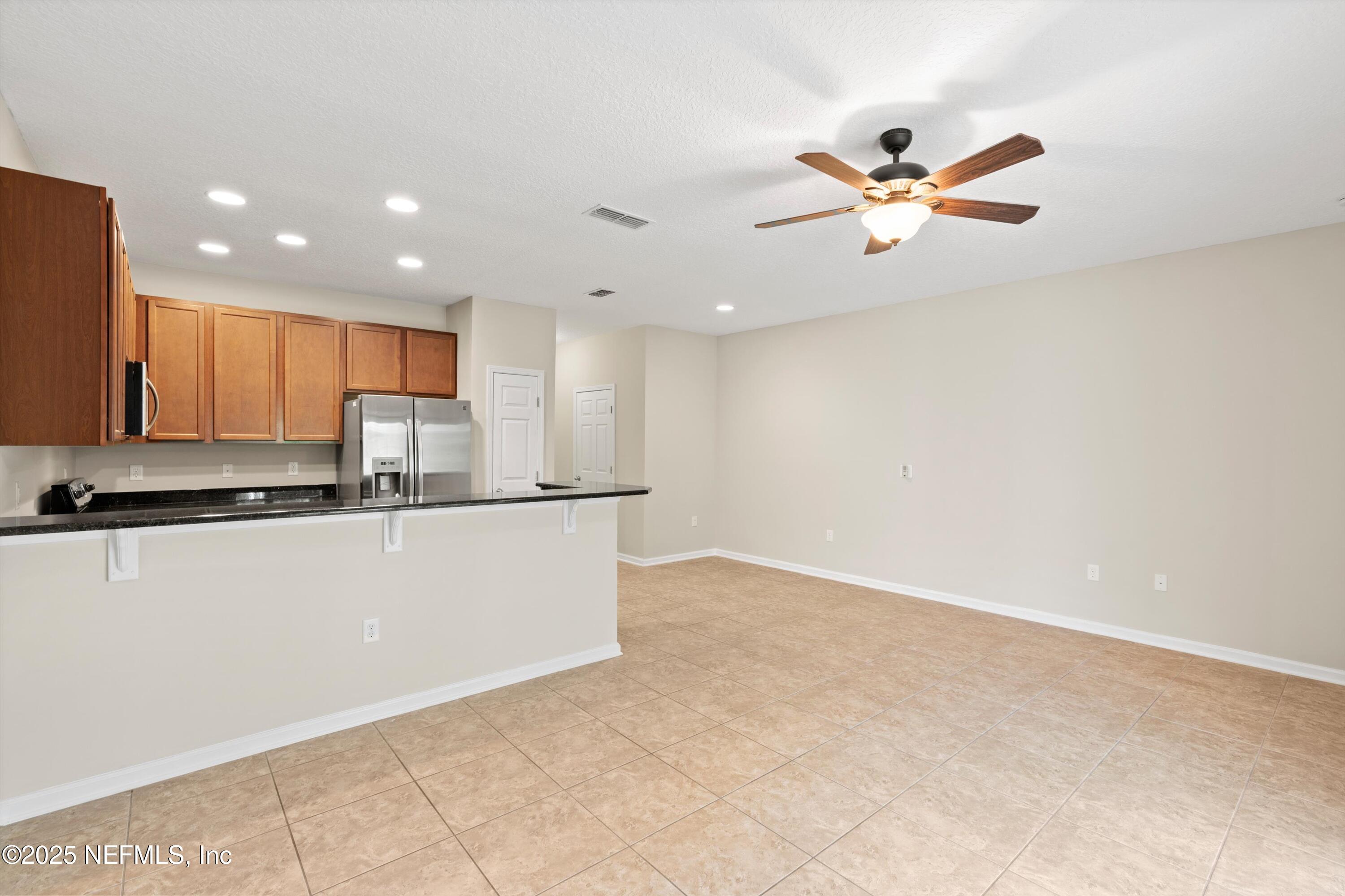 13340 Ocean Mist Drive Jacksonville, FL 32258 - Photo 9 of 25 a view of a kitchen with a sink and dishwasher