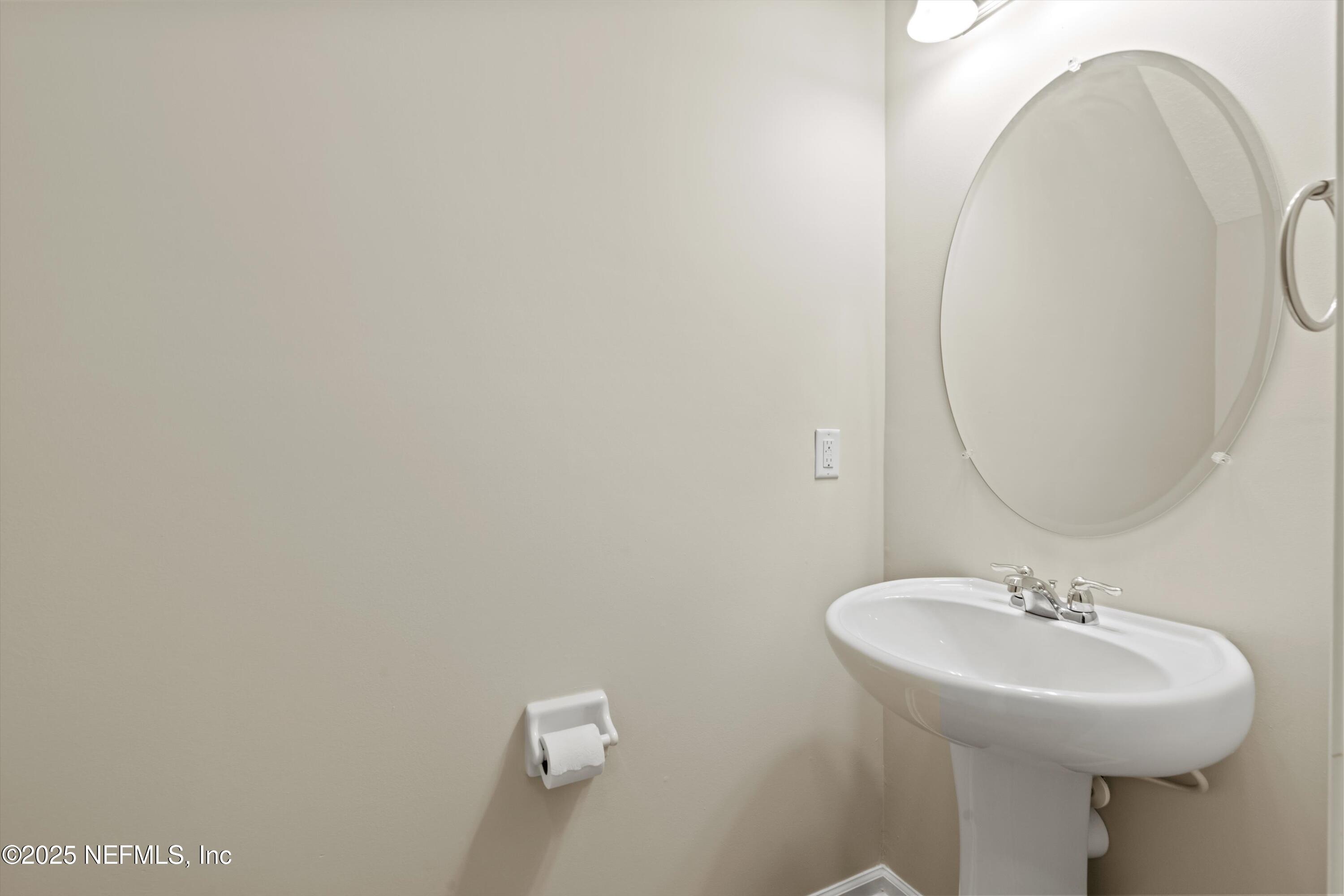 13340 Ocean Mist Drive Jacksonville, FL 32258 - Photo 10 of 25 a bathroom with a sink and a mirror