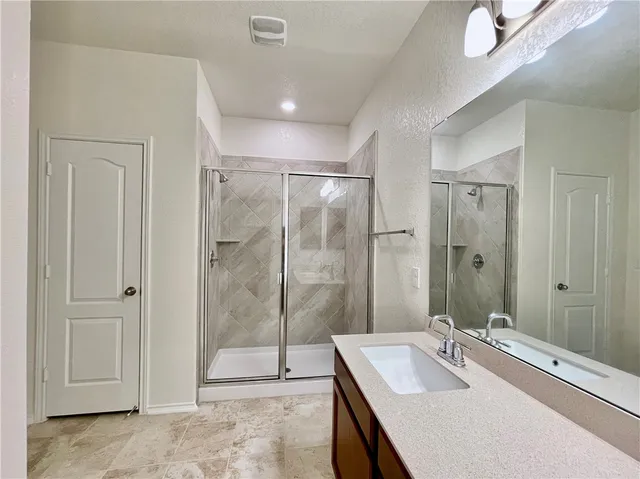 a bathroom with a bathtub and a sink