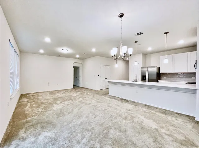 a view of a kitchen with a chandelier