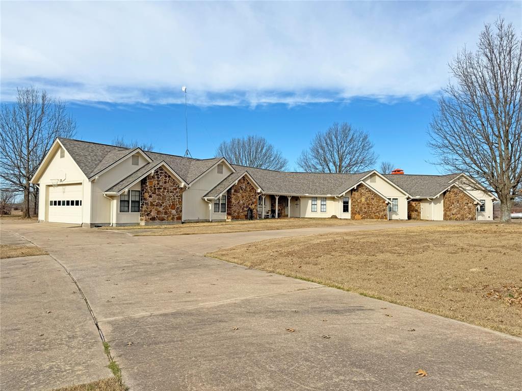 5393 Highway 5 Van Alstyne, TX 75495 - Photo 12 of 40 a view of a house with a yard and garage