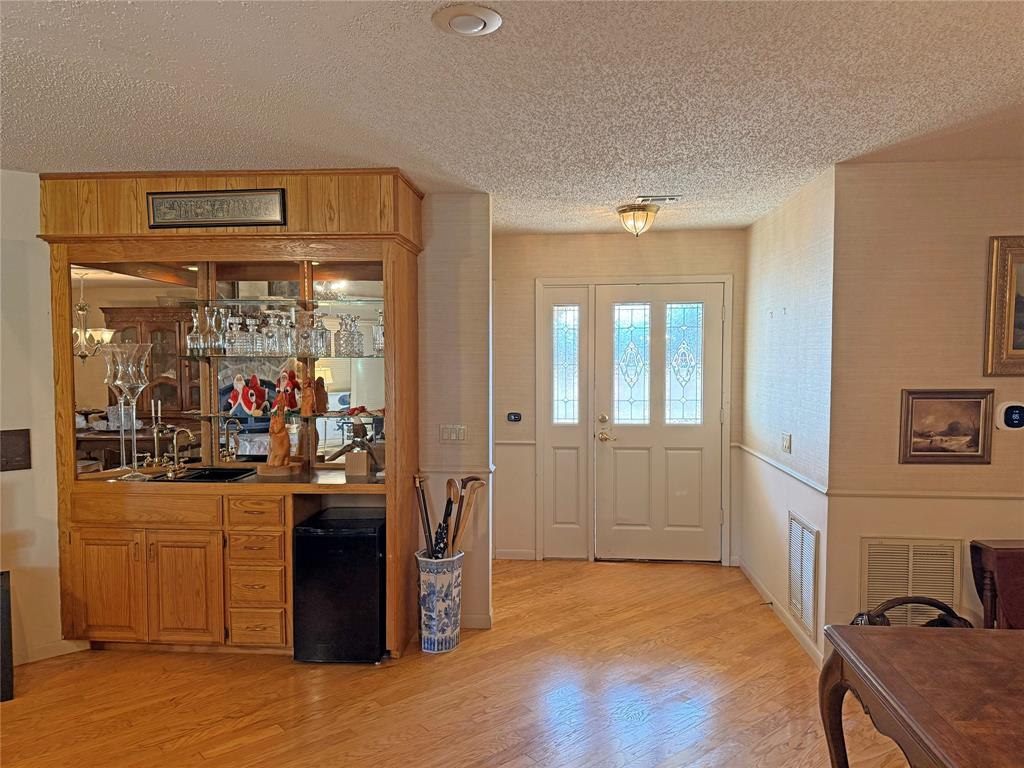 5393 Highway 5 Van Alstyne, TX 75495 - Photo 14 of 40 a view of a hallway with wooden floor and windows