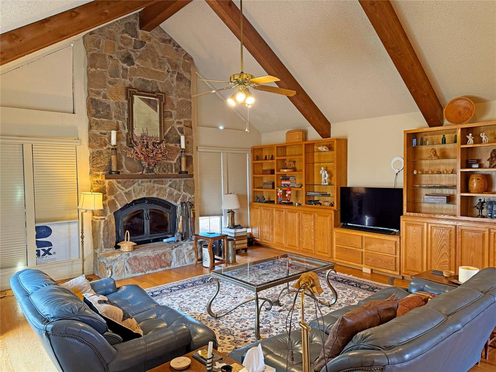 5393 Highway 5 Van Alstyne, TX 75495 - Photo 15 of 40 a living room with furniture flat screen tv and a fireplace