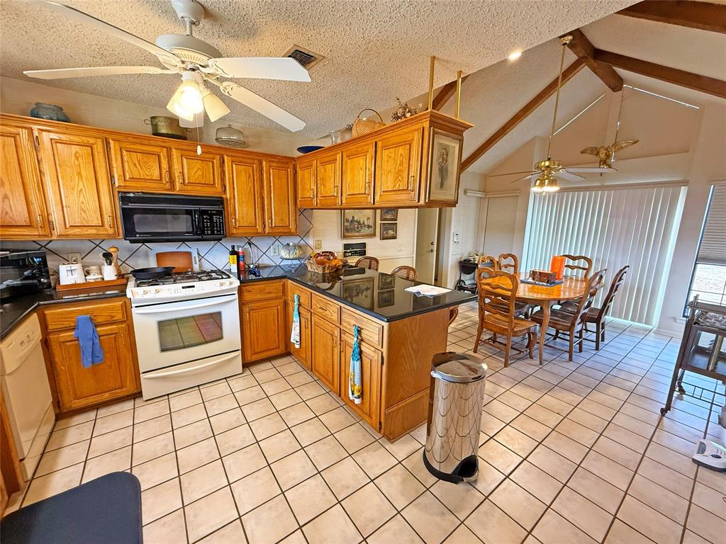5393 Highway 5 Van Alstyne, TX 75495 - Photo 19 of 40 a kitchen with a sink appliances and cabinets