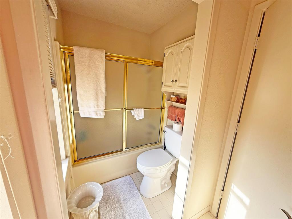 5393 Highway 5 Van Alstyne, TX 75495 - Photo 22 of 40 a bathroom with a shower and a toilet