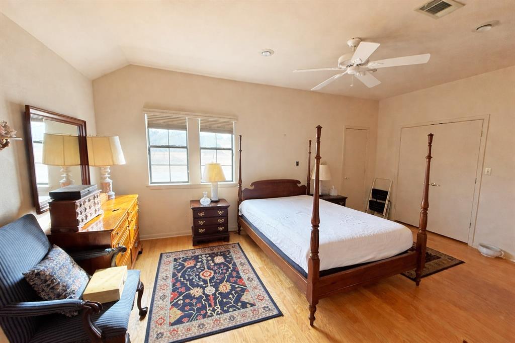 5393 Highway 5 Van Alstyne, TX 75495 - Photo 23 of 40 a bedroom with a bed and wooden floor