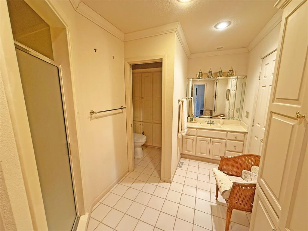 5393 Highway 5 Van Alstyne, TX 75495 - Photo 27 of 40 a bathroom with a sink a mirror and a shower