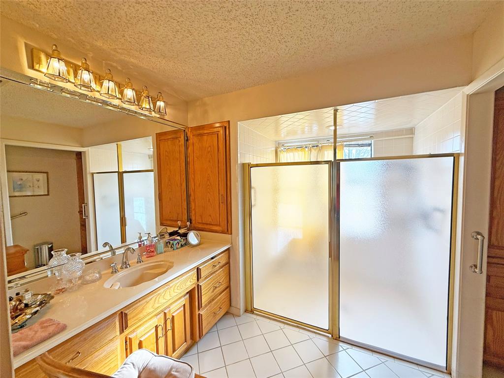 5393 Highway 5 Van Alstyne, TX 75495 - Photo 29 of 40 a bathroom with a double vanity sink mirror and shower