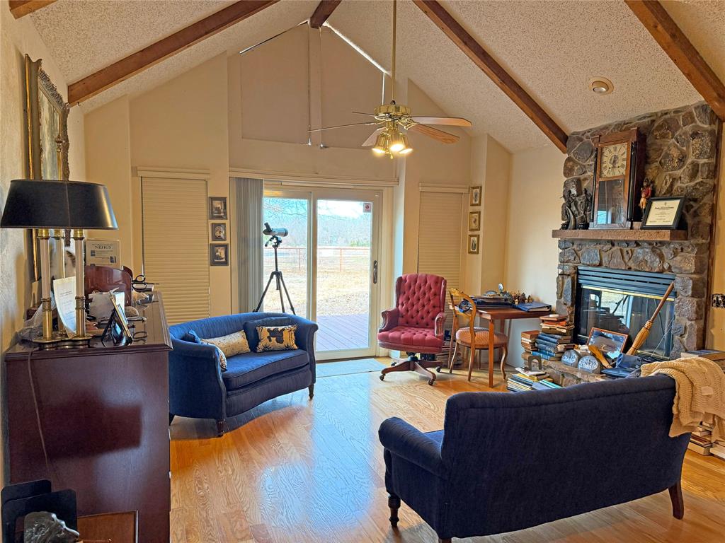 5393 Highway 5 Van Alstyne, TX 75495 - Photo 31 of 40 a living room with fireplace furniture and a chandelier