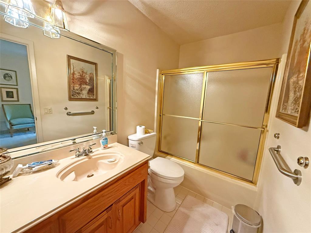 5393 Highway 5 Van Alstyne, TX 75495 - Photo 34 of 40 a bathroom with a sink a toilet a mirror and shower