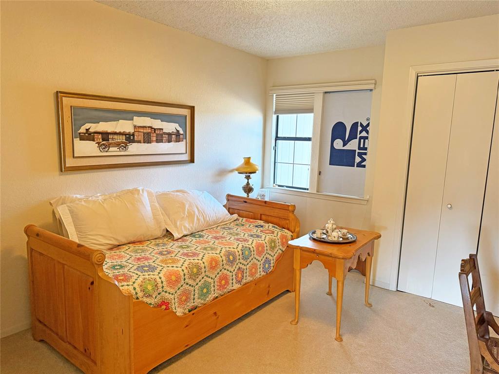 5393 Highway 5 Van Alstyne, TX 75495 - Photo 35 of 40 a bedroom with a bed and a table in it