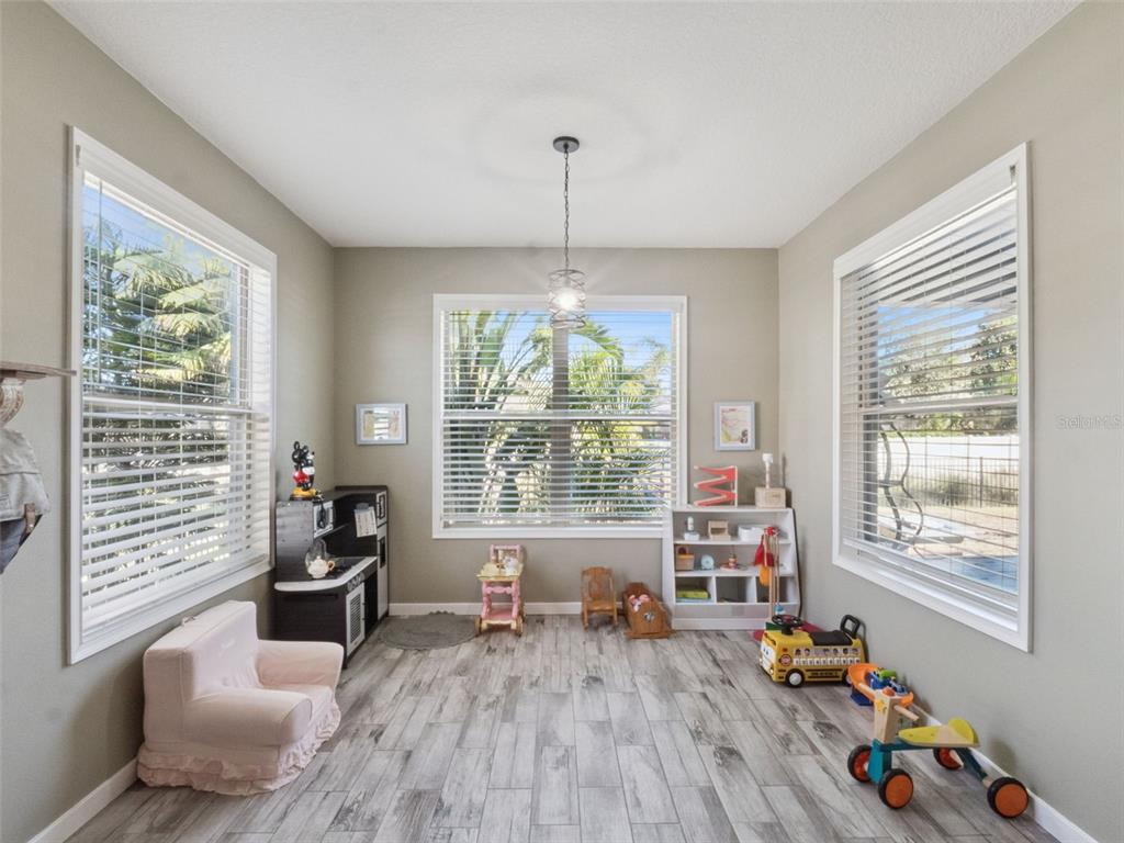 1025 Sadie Ridge Road Clermont, FL 34715 - Photo 16 of 50 a living room with furniture and a large window