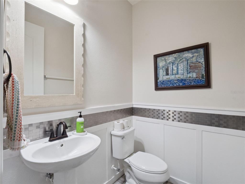 1025 Sadie Ridge Road Clermont, FL 34715 - Photo 18 of 50 a bathroom with a toilet a sink and mirror