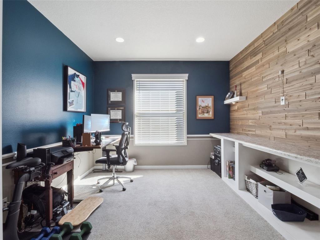 1025 Sadie Ridge Road Clermont, FL 34715 - Photo 19 of 50 a room with furniture a air conditioner and a window