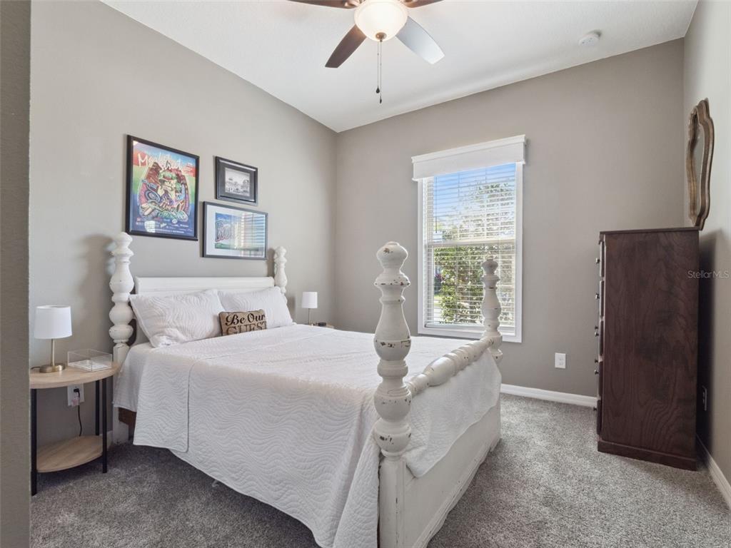 1025 Sadie Ridge Road Clermont, FL 34715 - Photo 27 of 50 a bedroom with a bed and a window