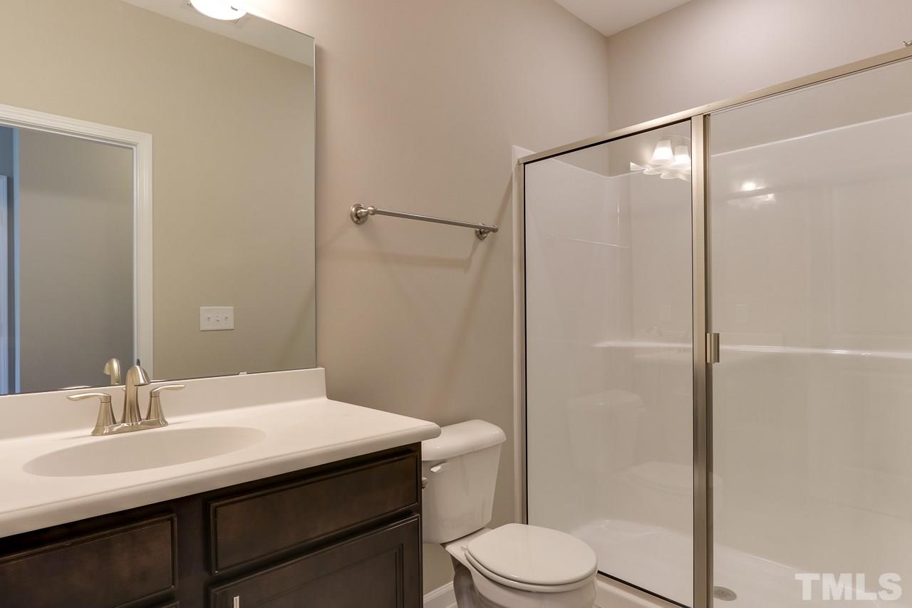 504 Cristobal Street, Unit 134 Rolesville, NC 27571 - Photo 16 of 30 a bathroom with a sink toilet and shower