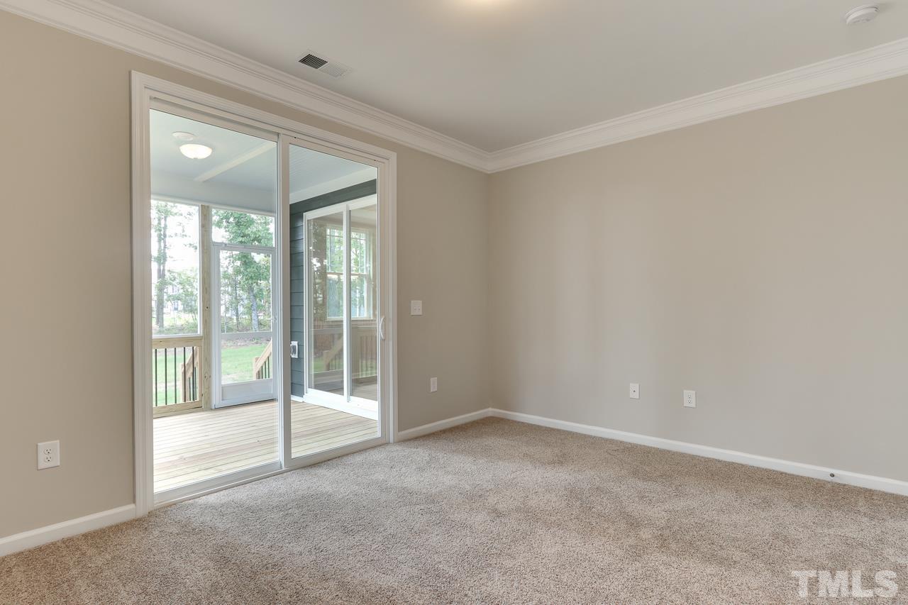 504 Cristobal Street, Unit 134 Rolesville, NC 27571 - Photo 17 of 30 a view of an empty room with glass door