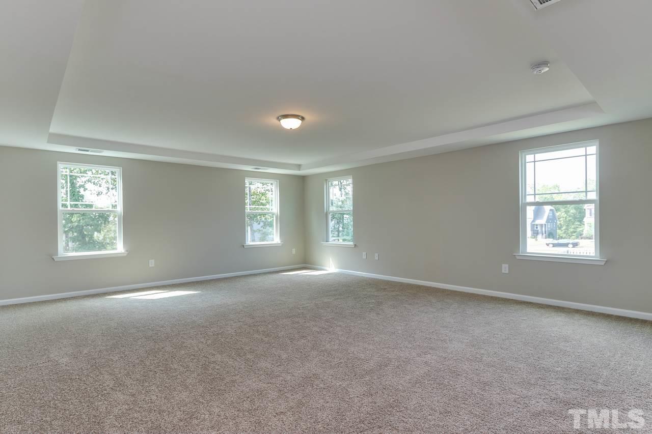 504 Cristobal Street, Unit 134 Rolesville, NC 27571 - Photo 19 of 30 a view of empty room with windows