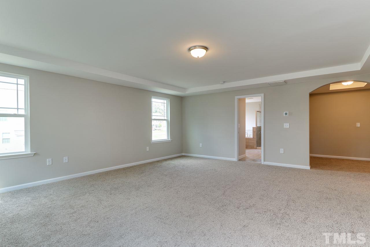 504 Cristobal Street, Unit 134 Rolesville, NC 27571 - Photo 20 of 30 a view of empty room with windows