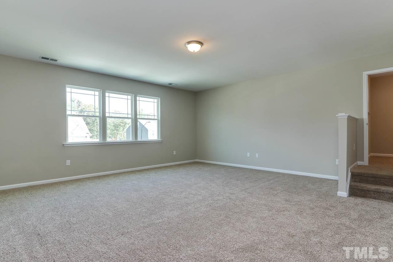504 Cristobal Street, Unit 134 Rolesville, NC 27571 - Photo 23 of 30 an empty room with windows