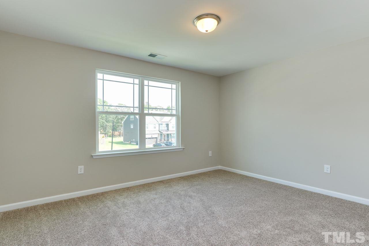 504 Cristobal Street, Unit 134 Rolesville, NC 27571 - Photo 25 of 30 an empty room with a window