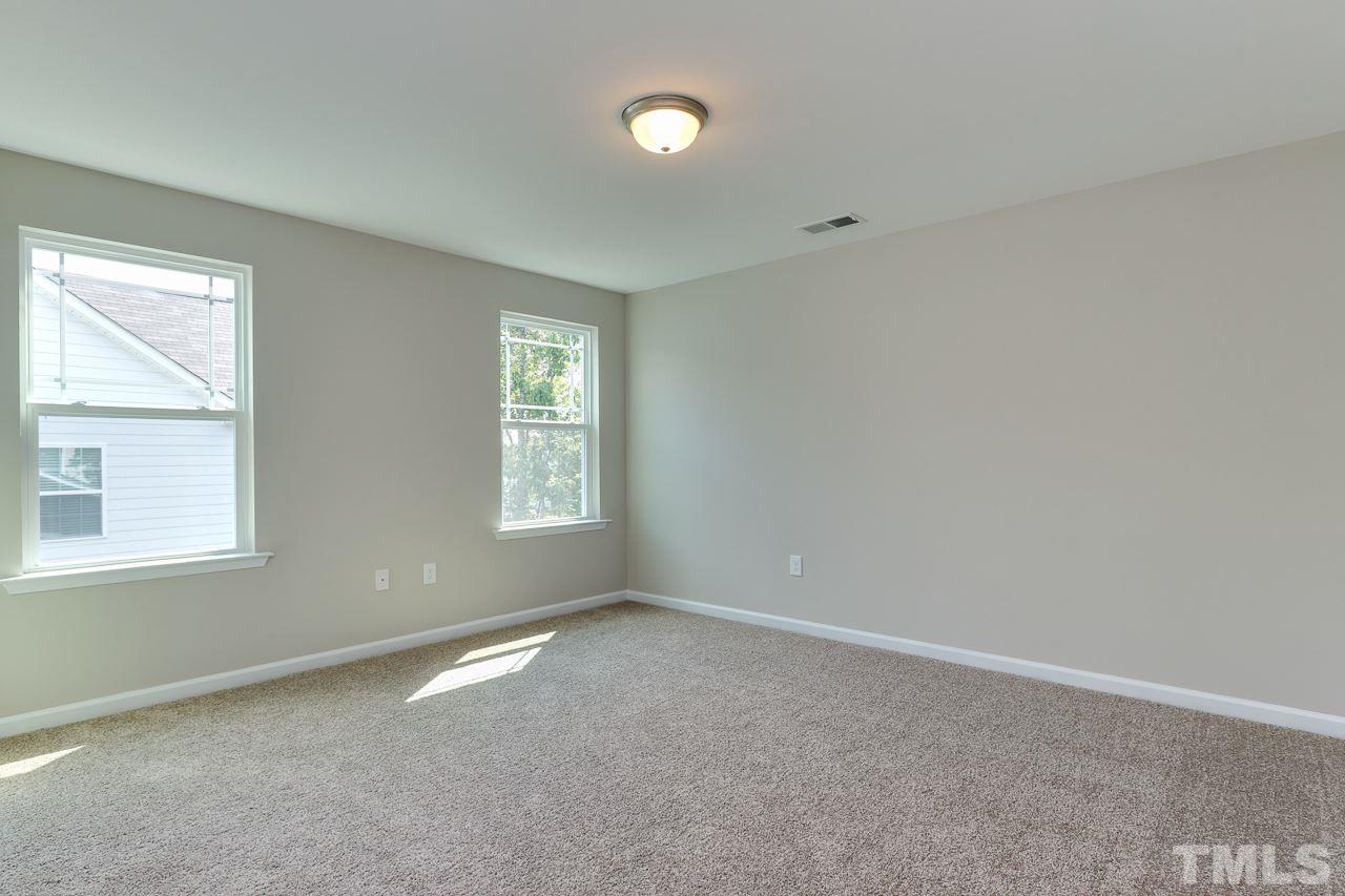 504 Cristobal Street, Unit 134 Rolesville, NC 27571 - Photo 27 of 30 an empty room with a window
