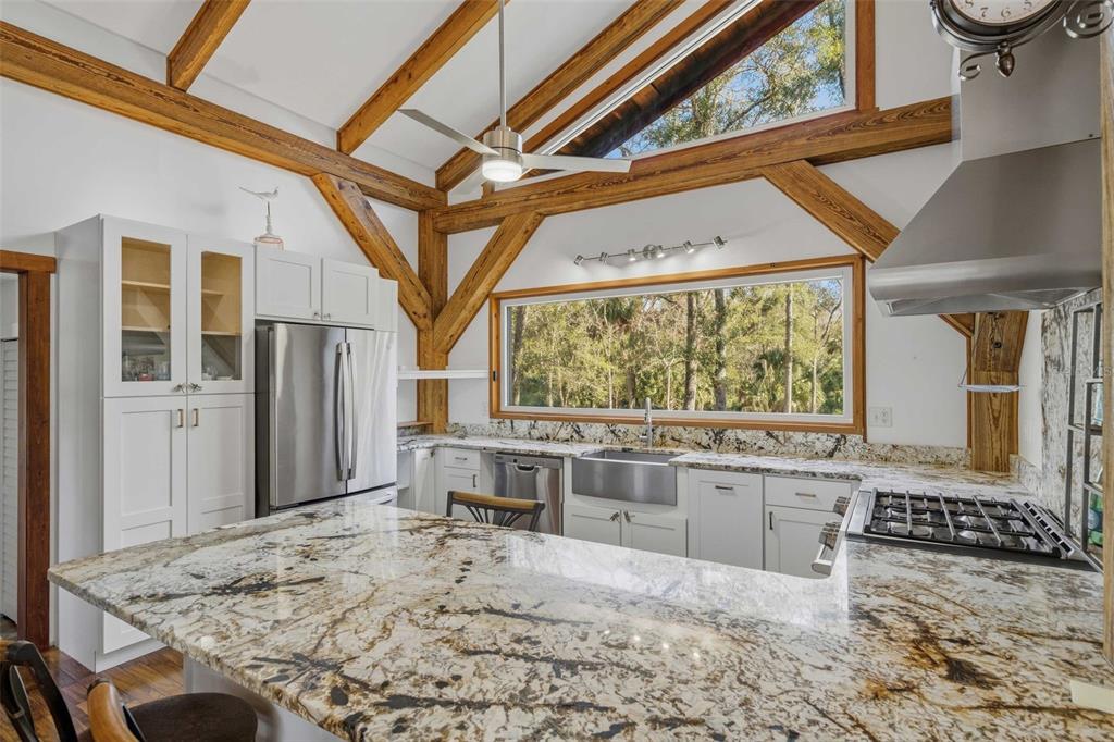 3490 Southeast 193rd Place Yankeetown, FL 34498 - Photo 14 of 71 a view of a kitchen with a stove and a window