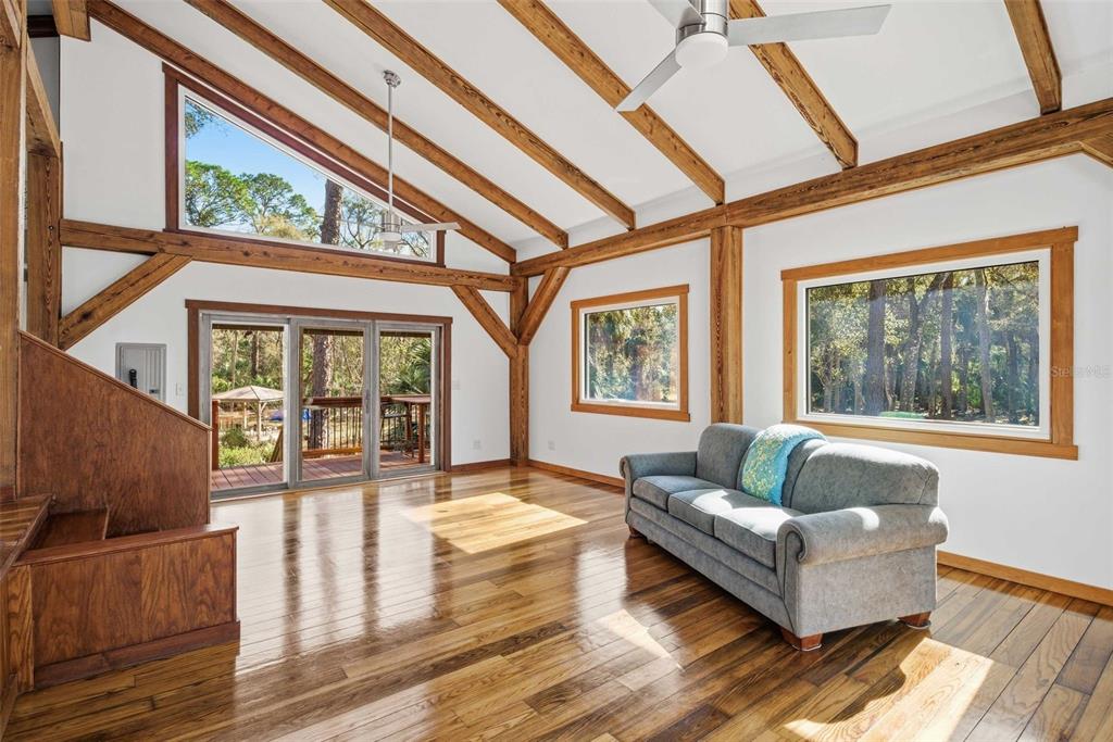 3490 Southeast 193rd Place Yankeetown, FL 34498 - Photo 20 of 71 a living room with furniture and a floor to ceiling window
