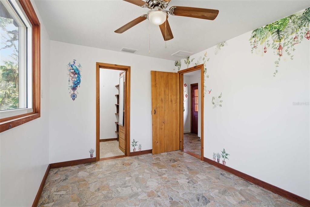 3490 Southeast 193rd Place Yankeetown, FL 34498 - Photo 28 of 71 an empty room with windows and fan