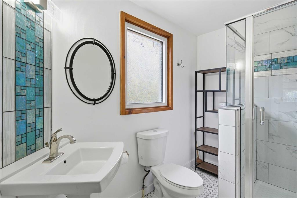 3490 Southeast 193rd Place Yankeetown, FL 34498 - Photo 30 of 71 a bathroom with a toilet sink and mirror